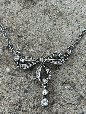 Nina Ricci Bow Pendant Necklace Rhodium Plated With Swarovski Crystals